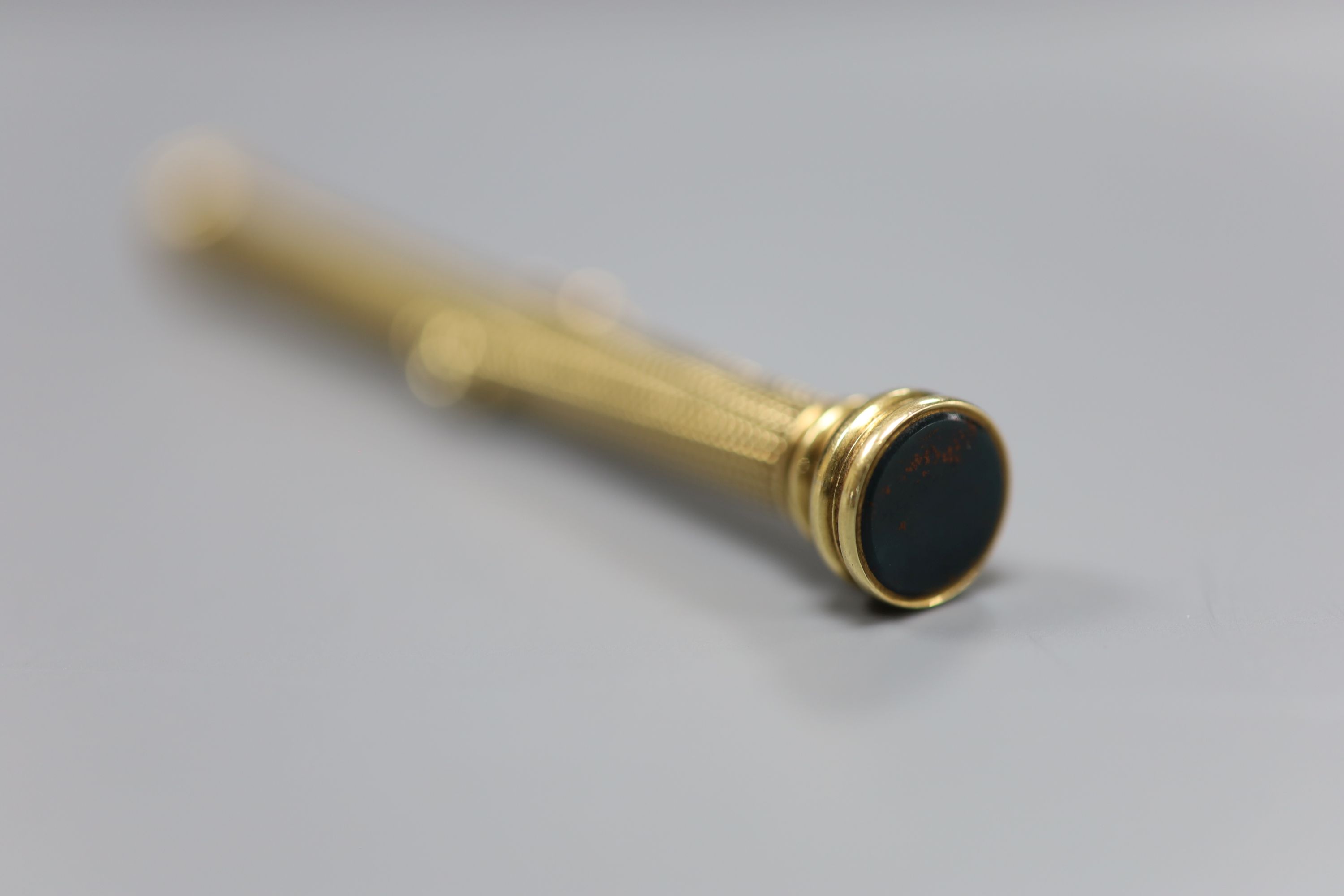 A late Victorian yellow metal overlaid and bloodstone inset propelling pencil and pen, by Sampson Mordan & Co, 9cm.